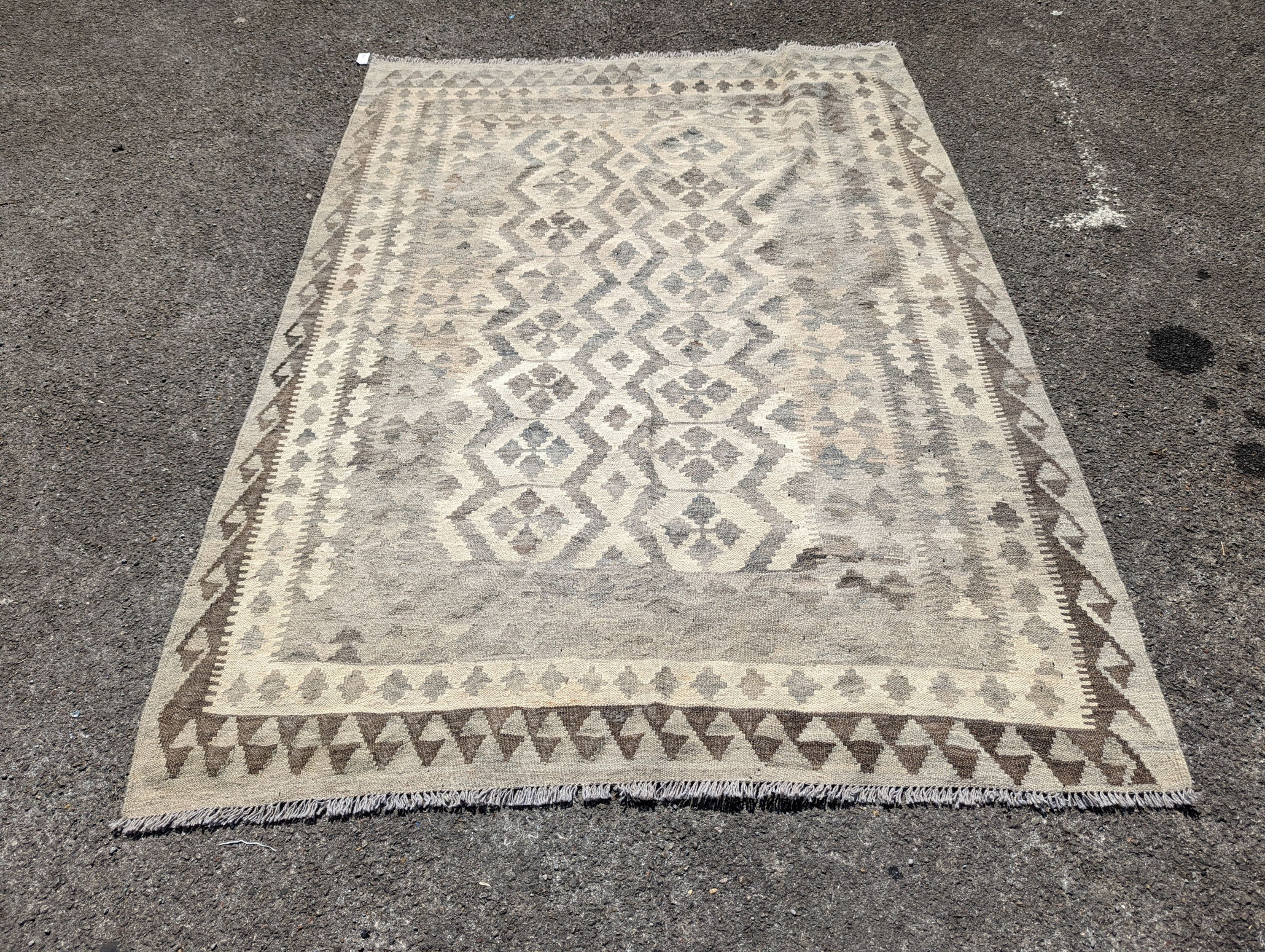 An Anatolian monochrome geometric flatweave carpet, 230 x 175cm